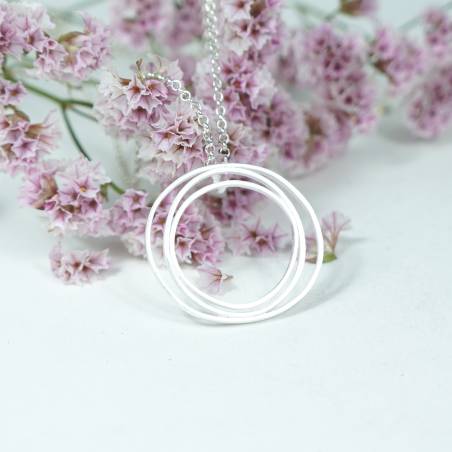 Round matte silver pendant in Barcelona