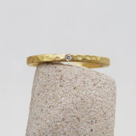 Yellow gold hammered wedding ring with diamond