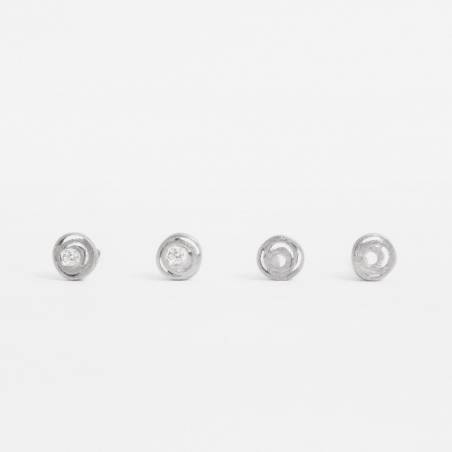 Newborn earrings, made in 18 kt white gold. They have a thread closure and a matt diamond finish.