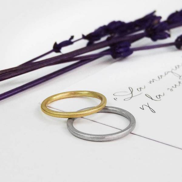 This simple engagement ring is handmade in 18k white gold.