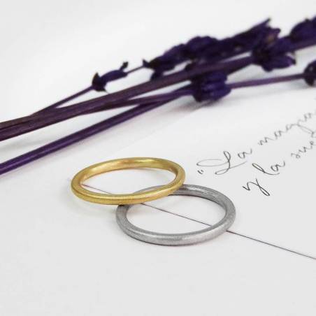 This simple engagement ring is handmade in 18k white gold.