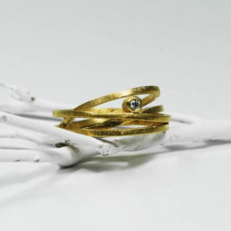 Silver design ring with gold and diamond bath.