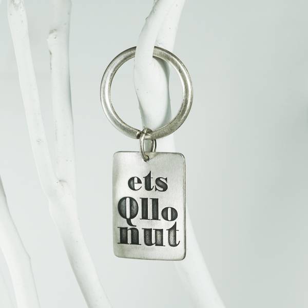 Original silver keychain of the first law