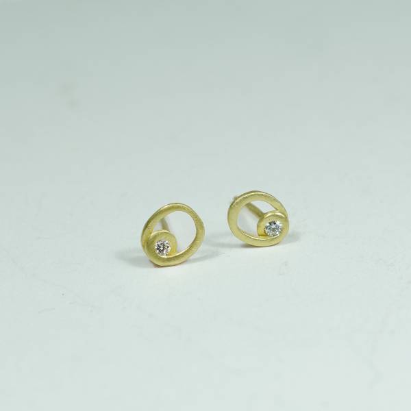 Minimalist gold earrings with diamonds