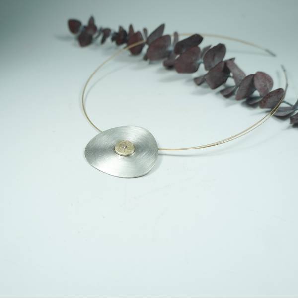Silver and gold pendant with diamonds