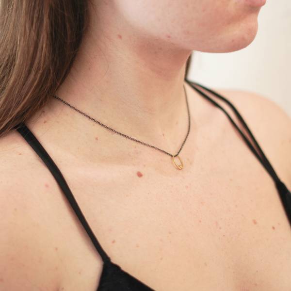 Tiny yellow gold pendant