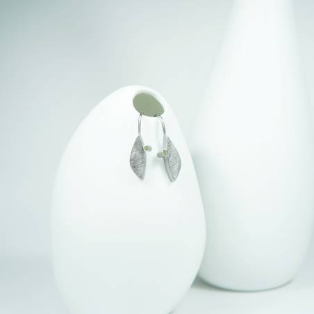 Small silver earrings with green gemstone