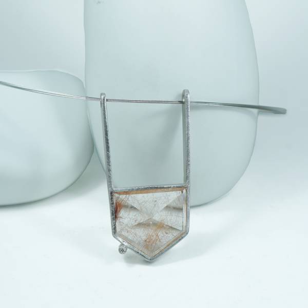 Genuine diamond in this silver pendant