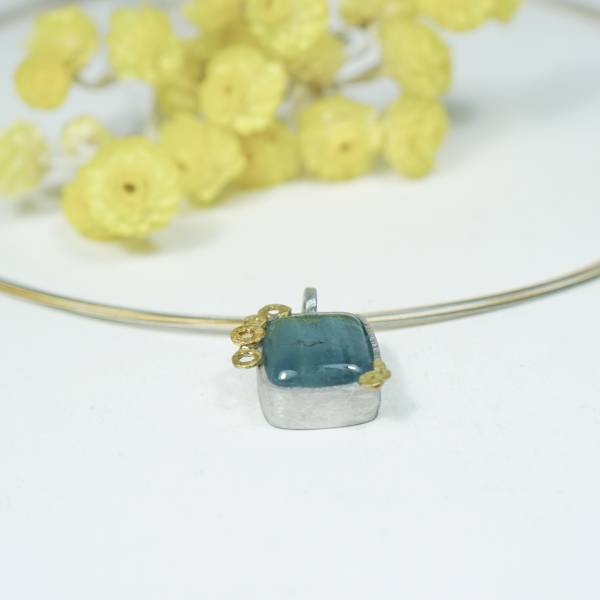 Silver and gold pendant with aquamarine