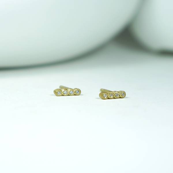 Tiny gold earrings